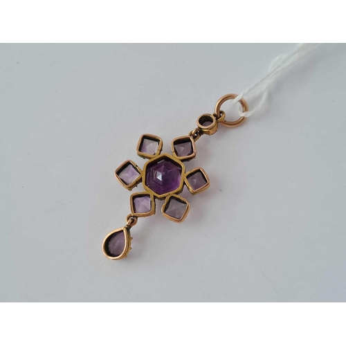 23 - A attractive antique gold mounted amethyst pendant