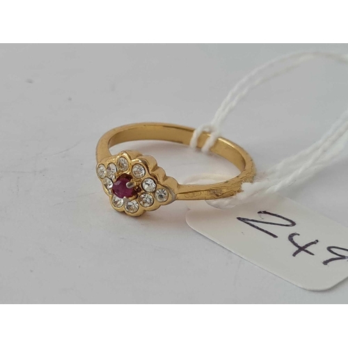 249 - A silver gilt red stone cluster ring size M