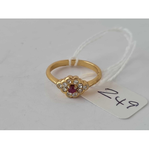 249 - A silver gilt red stone cluster ring size M