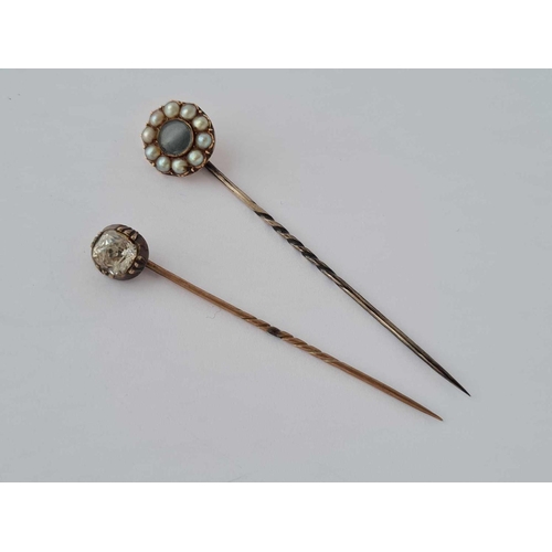 251 - A Georgian gold paste set stick pin and Victorian gold and pearl memorial stick pin