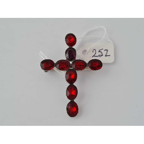 252 - A Victorian silver and red paste set cross brooch