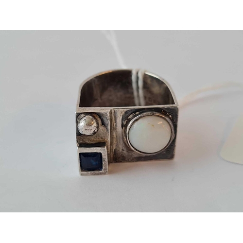 255 - A large 1970s silver sapphire and opal ring (London 1974) size M