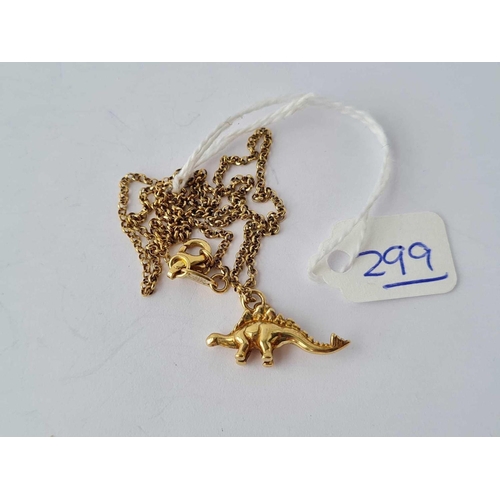 299 - A silver gilt dinosaur pendant on 16 inch chain