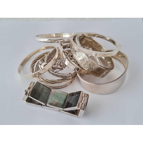 312 - A bag of assorted silver bracelets and bangles - 234 gms