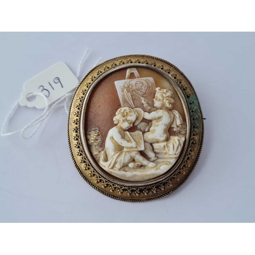 319 - A metal framed cameo brooch of cherubs painting