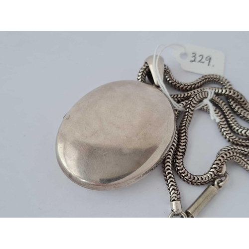 329 - A good antique large silver locket and chain 18 inches