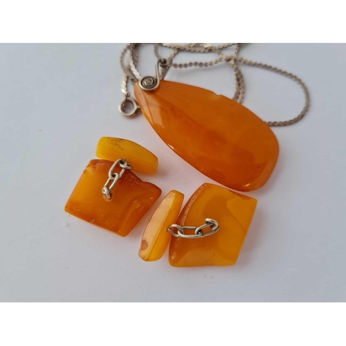 353 - A butterscotch amber and silver pendant - 5 gms on silver chain - 4.6 gms and butterscotch amber and... 