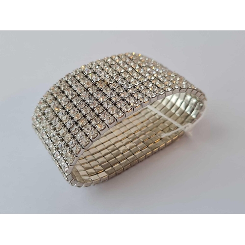 367 - A ten row wide diamante Art Deco style expanding bangle