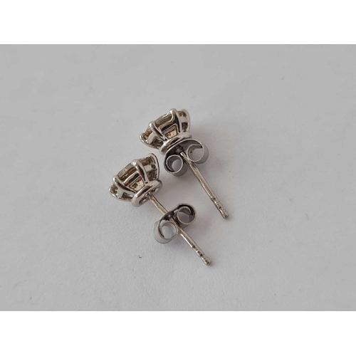 374 - A GOOD PAIR OF PLATINUM AND DIAMOND EAR STUDS ( APPROX 1 CT )