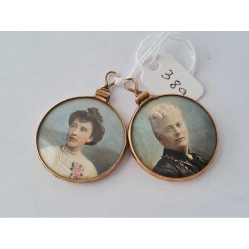 389 - A pair of antique gold double sided lockets