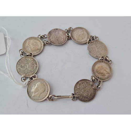 409 - A silver coin bracelet