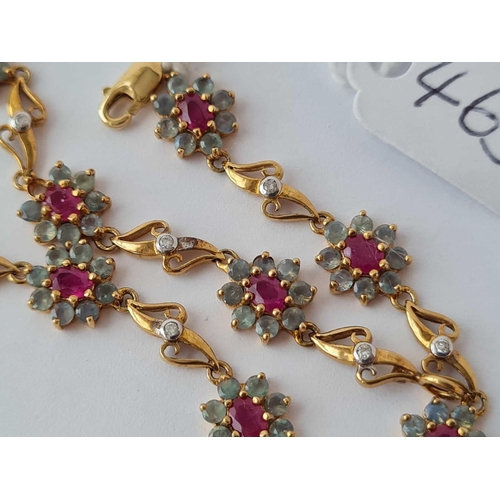 465 - AN ATTRACTIVE FANCY LINK BRACELET WITH NINE RUBY AND ALEXANDRITE CLUSTERS IN 9CT GOLD - 5.4 GMS INC.... 