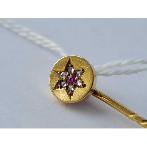 473 - A ruby and diamond star bust stick pin 15ct gold - 1.7 gms