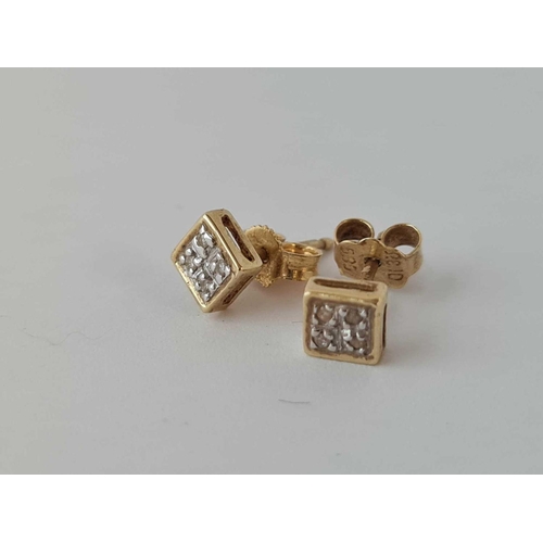 498 - A pair of square shaped diamond earrings 9ct