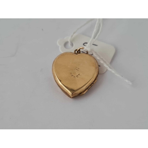 5 - A gold hinged locket 9ct