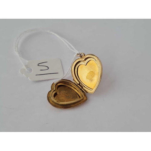 5 - A gold hinged locket 9ct