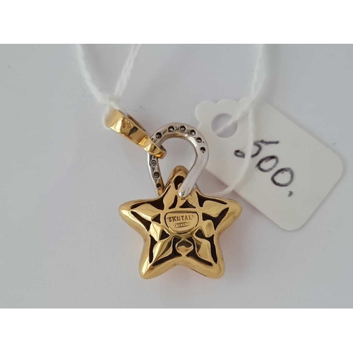 500 - A DIAMOND STAR PENDANT 18CT GOLD - 5.7 GMS