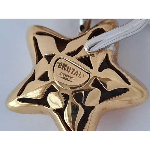 500 - A DIAMOND STAR PENDANT 18CT GOLD - 5.7 GMS