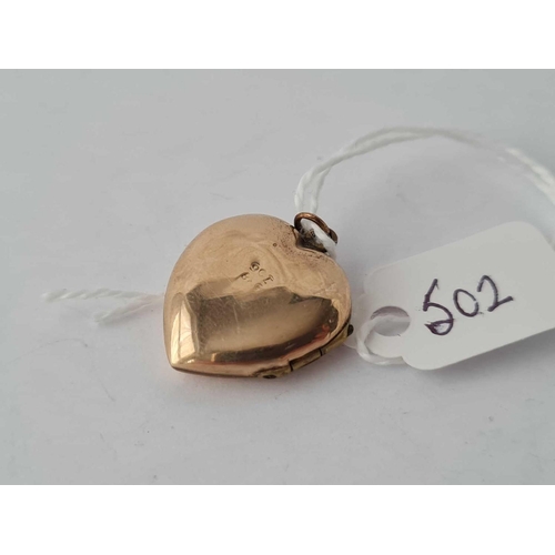 502 - A heart shaped back and front locket 9ct - 2.9 gms