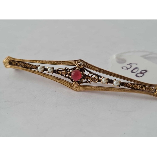 508 - A pearl and red stone brooch 14ct gold - 4.2 gms