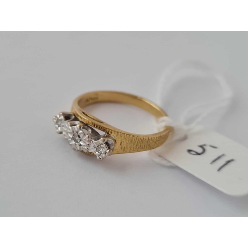 511 - A three stone diamond ring 18ct gold size M - 3.5 gms