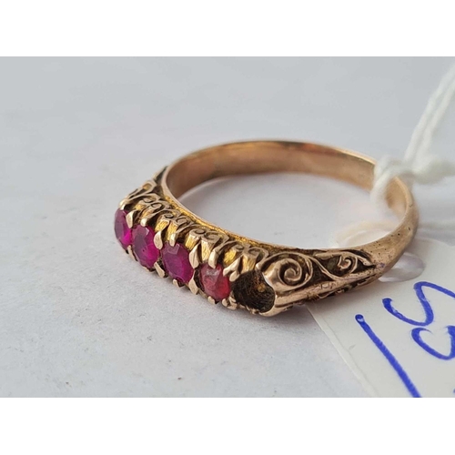 537 - A gold five stone ruby ring (one stone missing) size L - 2.5 gms