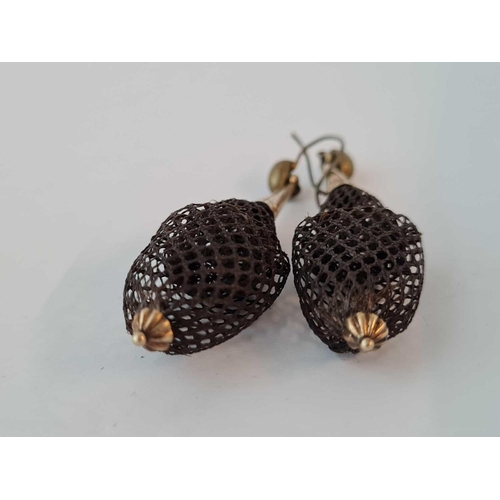 557 - A pair of antique hair earrings