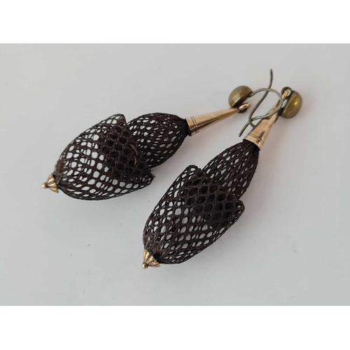 557 - A pair of antique hair earrings