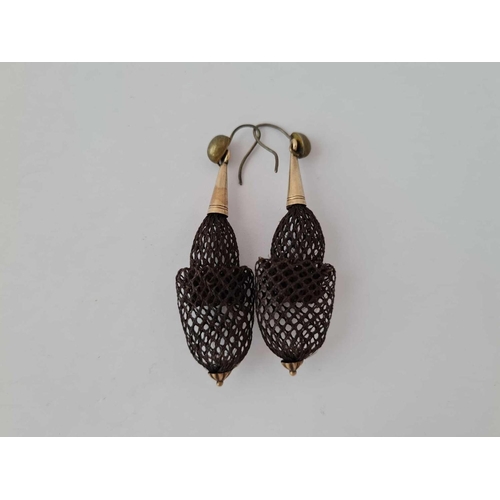 557 - A pair of antique hair earrings