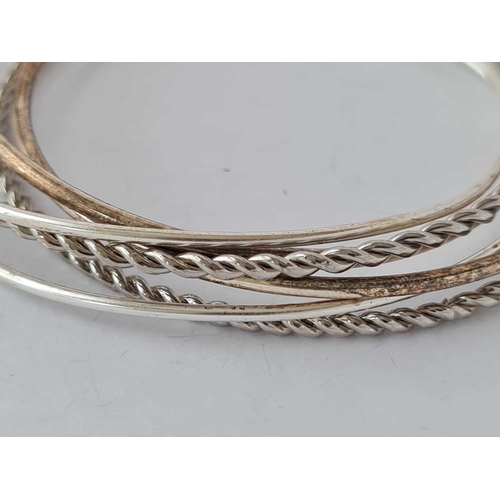 561 - A set of six silver slender slave bangles