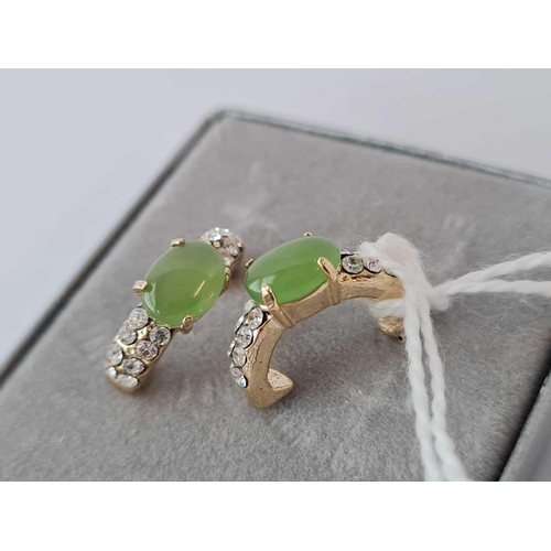 566 - A pair of Canadian jade earrings