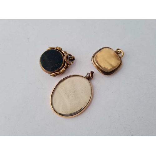 588 - Two rolled gold fobs and locket