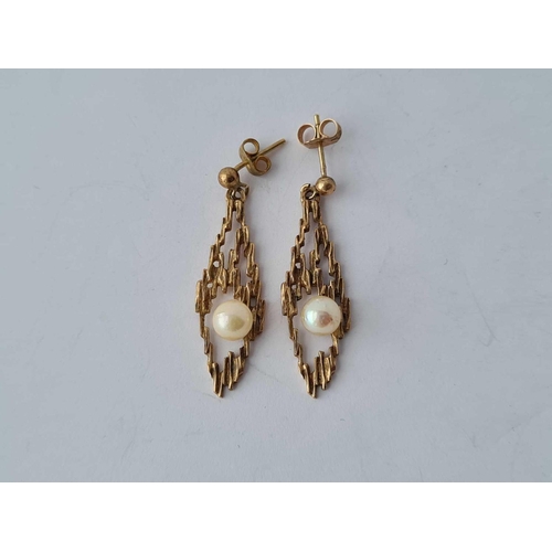 593 - A textured drop earrings set with pearls 9ct - 3.2 gms