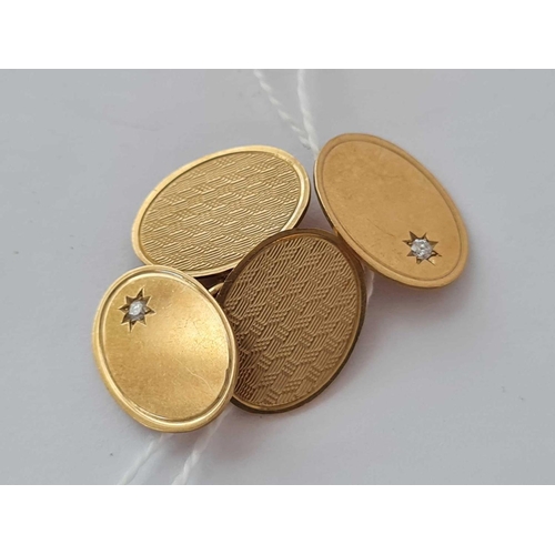 597 - A pair of oval cufflinks set with diamonds 9ct - 7.8 gms