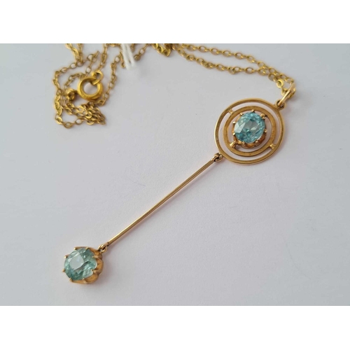 60 - A Edwardian high carat gold (tested) aquamarine pendant and chain