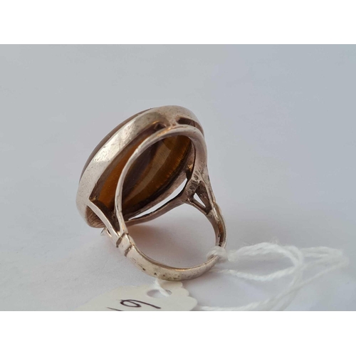 611 - A large oval silver tigers eye ring