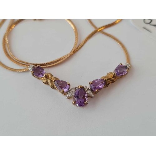 62 - An attractive amethyst & diamond gold pendant necklace 4.2g inc