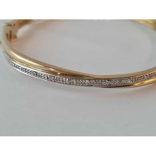 63 - 9ct diamond bangle 9.2g inc