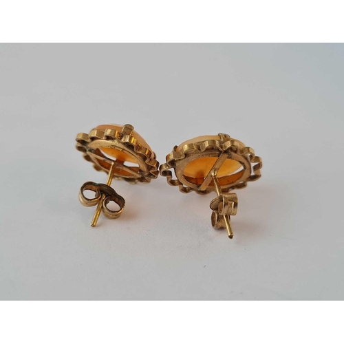 635 - A pair of gilt metal cameo earrings