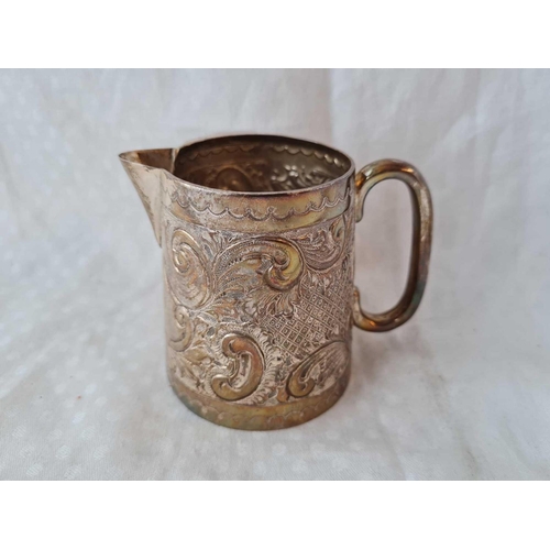 662 - An Edwardian milk jug embossed with scrolls, 3