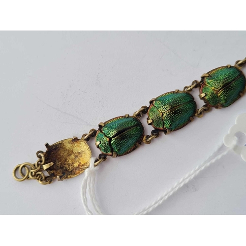 86 - A scarab bracelet (one missing)