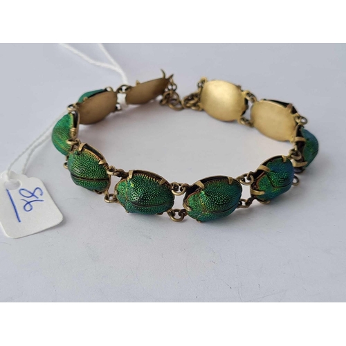 86 - A scarab bracelet (one missing)