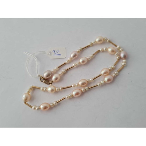 92 - A silver and pearl necklace