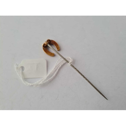 99 - A gold topped pearl stick pin