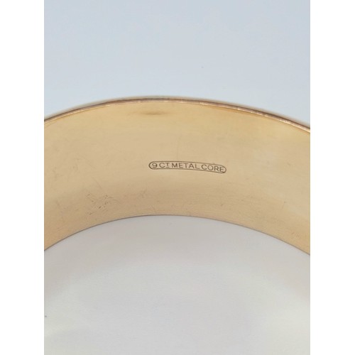 200 - 9ct gold metal core bangle , 38.7g