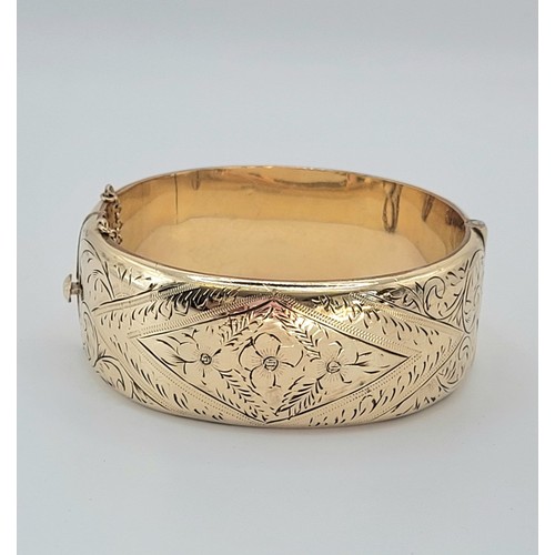 200 - 9ct gold metal core bangle , 38.7g