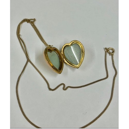 196 - Vintage 9ct gold back and front locket on yellow metal chain