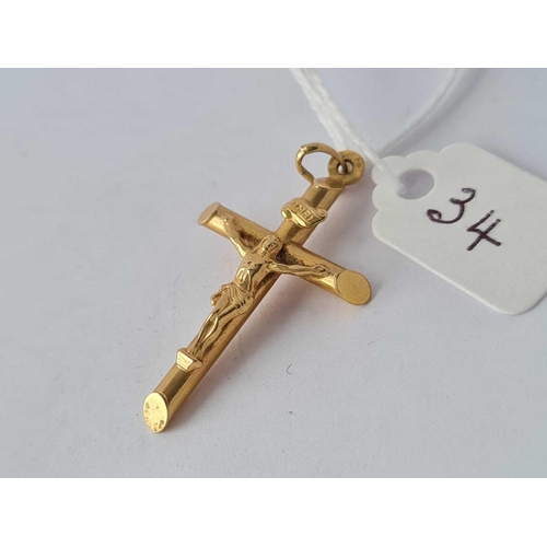 34 - A large 9ct cross  1.7 gms