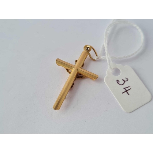 34 - A large 9ct cross  1.7 gms