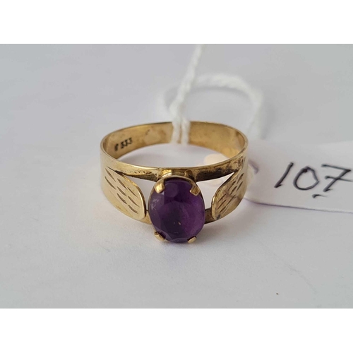 107 - An 8ct gold purple stone dress ring size O 2g inc